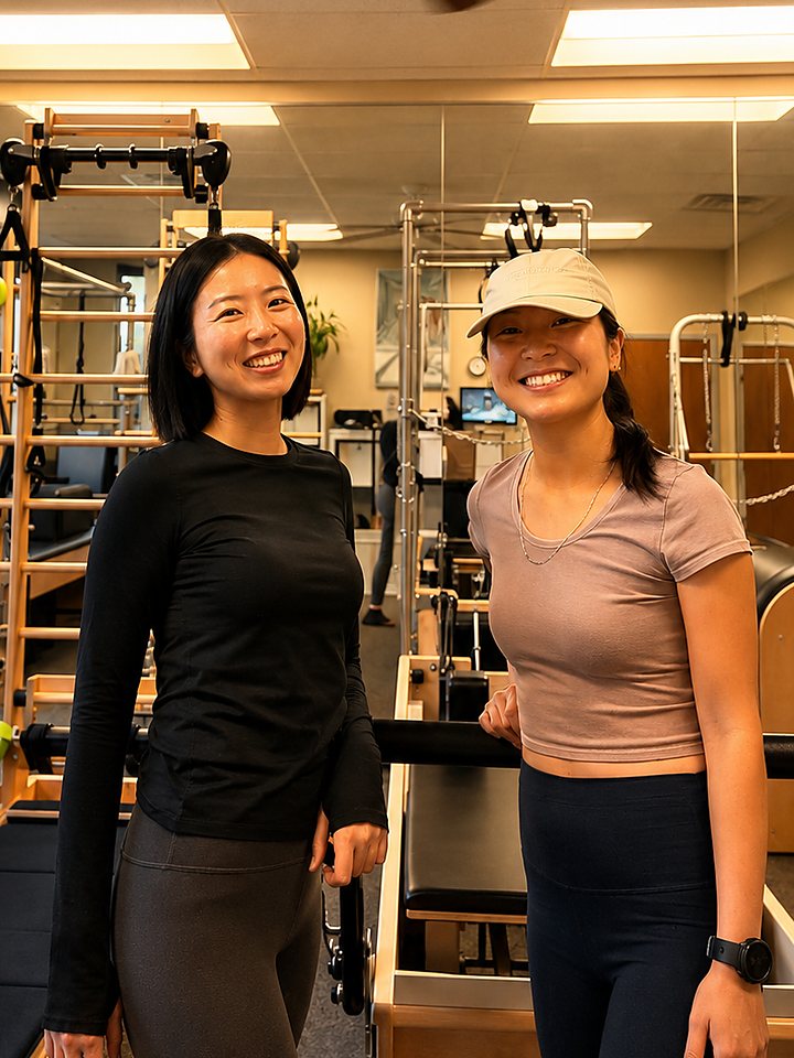 Kiki with a client in her private Pacific Beach reformer studio