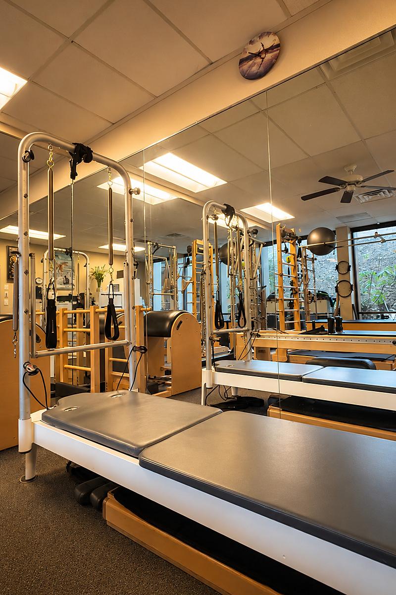 Warm, light-filled reformer in the private Pacific Beach Pilates studio